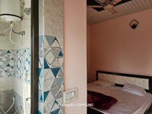 Letto o letti in una camera di Shri Mahaveer Residency