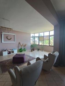 a living room with two chairs and a couch at B&B Bellavista Gerace in Gerace
