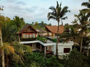 an aerial view of a house with palm trees at Alankara Villa & Spa Ubud by Mahaprana in Tegalalang