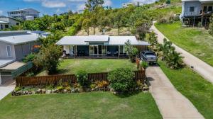 an aerial view of a house with a yard at Bayview - Three Bedroom, Family & Pet Friendly Coastal Getaway in Agnes Water in Agnes Water