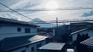 a view of the roofs of buildings in a city at Fuji Holiday in Fujiyoshida
