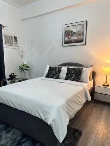 Ένα ή περισσότερα κρεβάτια σε δωμάτιο στο Davao City Studio Unit Condo near airport