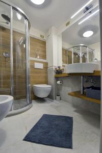 a bathroom with a sink and a toilet and a shower at Coeur Blanc in Verrand