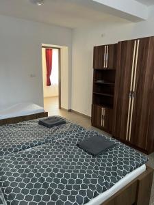 Postel nebo postele na pokoji v ubytování Helga Apartman