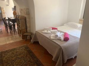 Voodi või voodid majutusasutuse Trulli Santa Maria Odegitria Relais toas