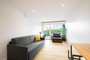Ein Sitzbereich in der Unterkunft Homaris Apartments München Laim