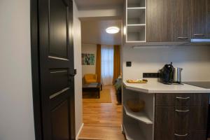 a kitchen with a sink and a counter top at Homey Apartment at Tartu Woody Karlova & FREE parking 2 in Tartu