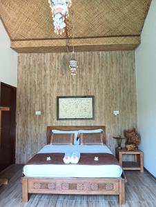 Postel nebo postele na pokoji v ubytování Calmness Villa Syariah