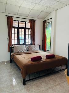Postel nebo postele na pokoji v ubytování Baan Archa Samui + 24 fotografií