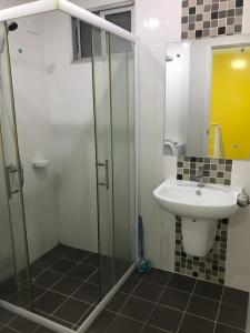 a bathroom with a sink and a glass shower at Nido house in Ban Bang Phang +19 photos