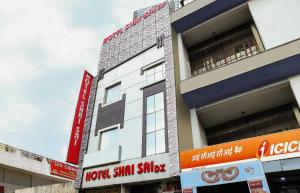 a building with signs on the side of it at Hotel O Shri Sai in New Delhi