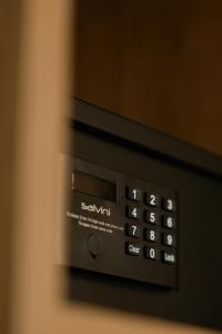 a close up of the control panel of a microwave oven at Bronze Suites in Ioannina +43 photos