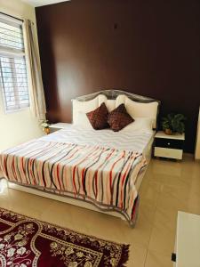 Postel nebo postele na pokoji v ubytování Ava Homestay