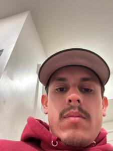 a man wearing a hat with a mustache at Topacio in Taylorsville