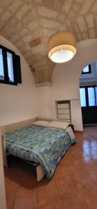 A bed or beds in a room at Giulia's House