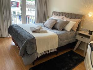 Katil atau katil-katil dalam bilik di Alto padrão a 5min da Vila Germânica 3 quartos com berço