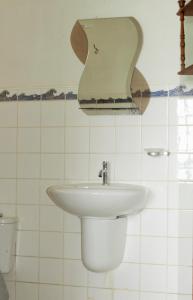 a bathroom with a sink and a toilet at El Merlin - Cabo Blanco in Cabo Blanco