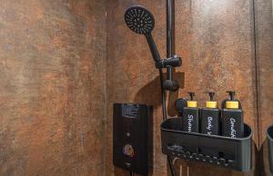 a wall with a hair dryer in a holder at Town centre apartment in Kendal