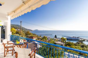 a balcony with a view of the ocean at Andromachi's house in Loutraki