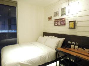Postel nebo postele na pokoji v ubytování Re-Change Hotel Taipei