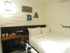 Postel nebo postele na pokoji v ubytování Re-Change Hotel Taipei