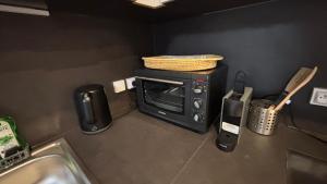 Kuchyň nebo kuchyňský kout v ubytování T2 - vue lac - 100 m du Hilton - Garage privé - 4 étoiles