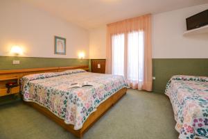 Posteľ alebo postele v izbe v ubytovaní Hotel Splendor