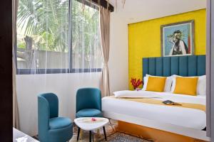 a hotel room with a bed and a window at Royale Amata By the Beach in Morjim +54 photos