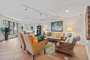 a living room with a couch and chairs at Seachase 1503W in Orange Beach