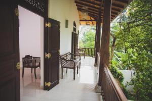 Balkón nebo terasa v ubytování Villa Frangipani