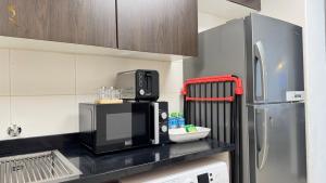 Dapur atau dapur kecil di Trendy 1BR for 3 Guests in Al Reem