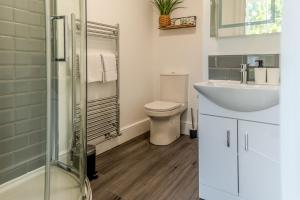 a bathroom with a toilet and a sink at Hillary's Hideaway in Broseley +34 photos
