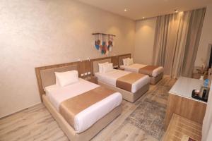 Voodi või voodid majutusasutuse Jewel Alfustat Hotel toas