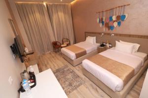 Voodi või voodid majutusasutuse Jewel Alfustat Hotel toas
