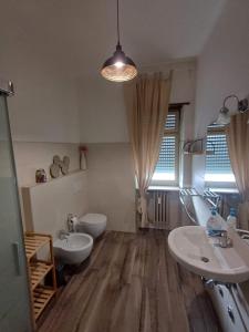 Koupelna v ubytování L'Arena Residence + 37 fotografií