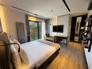 Телевизор и/или развлекательный центр в Villa Business Hotel Istanbul Airport