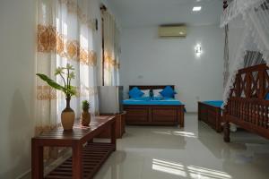 Letto o letti in una camera di Azure Resort Mirissa