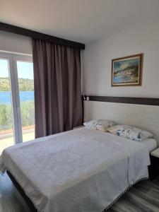 Posteľ alebo postele v izbe v ubytovaní VILLA LAURA