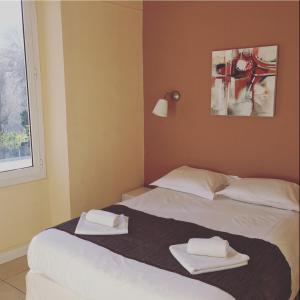 Postel nebo postele na pokoji v ubytování Hotel Danemark