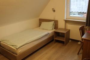Postel nebo postele na pokoji v ubytování Hotel Garni Postkutsche