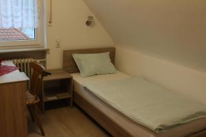 Postel nebo postele na pokoji v ubytování Hotel Garni Postkutsche