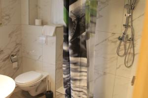 Koupelna v ubytování Hotel Garni Postkutsche