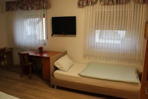 Postel nebo postele na pokoji v ubytování Hotel Garni Postkutsche