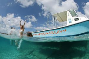 two people on a boat in the water at Eden Beach Resort - Bonaire in Kralendijk