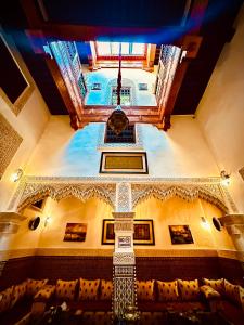 a view of the ceiling of a room with chairs at Riad Le Petit Patrimoine De Fés in Fès