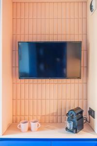 TV a/nebo společenská místnost v ubytování Appartement Design et Confortable