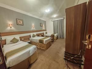 Katil atau katil-katil dalam bilik di فندق مقام الحجاز maqamalhijaz hotel
