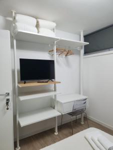 TV a/nebo společenská místnost v ubytování CASA CLEO