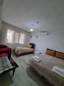 Postel nebo postele na pokoji v ubytování HAPPY HOUSE 2 Pamukkale