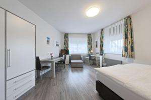 Postel nebo postele na pokoji v ubytování Hotel Hülsmann Garni